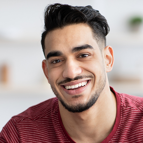 handsome-arab-guy-chilling-at-home-smiling-at-came-2S8NTKW